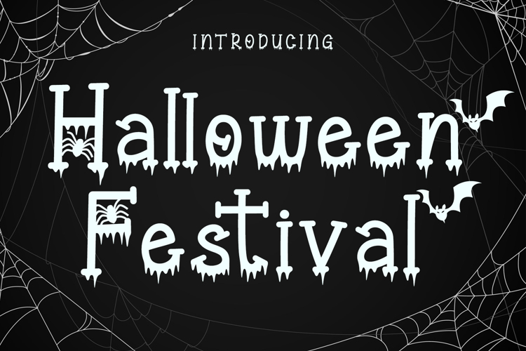 Free Halloween Font: Spooky "Halloween Festival" text with cobwebs and bats on a black background.