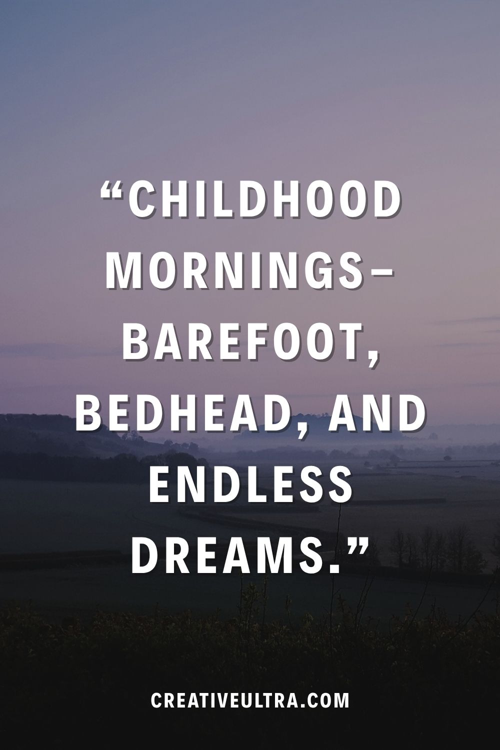 Text reading "Childhood mornings—barefoot, bedhead, and endless dreams" on a dreamy, soft-focused landscape of fields at dawn. Calm, nostalgic mood.